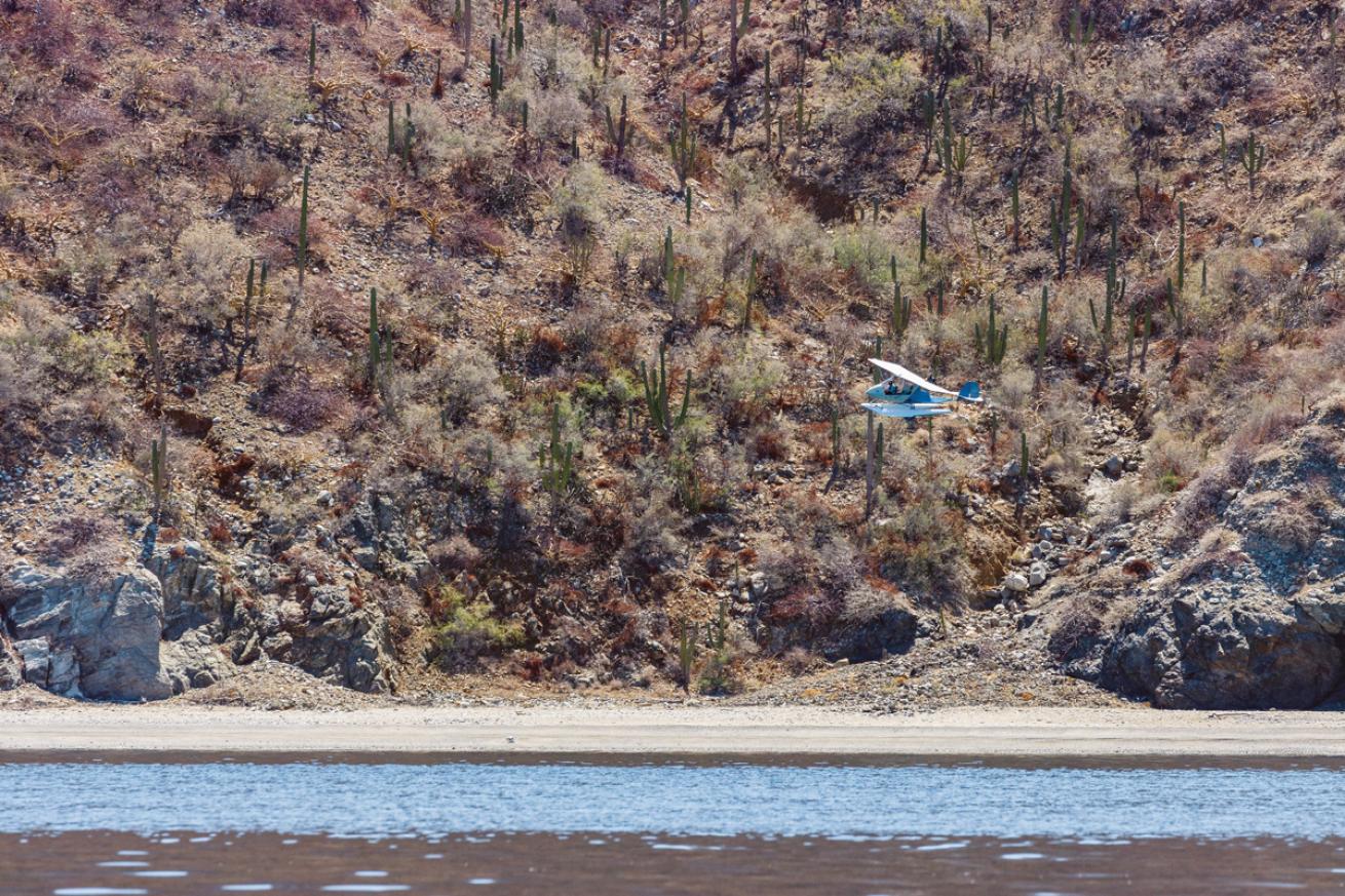 pilot Siddharta Velazquez flies a spotter plane to gather scientific data and assist local scientists