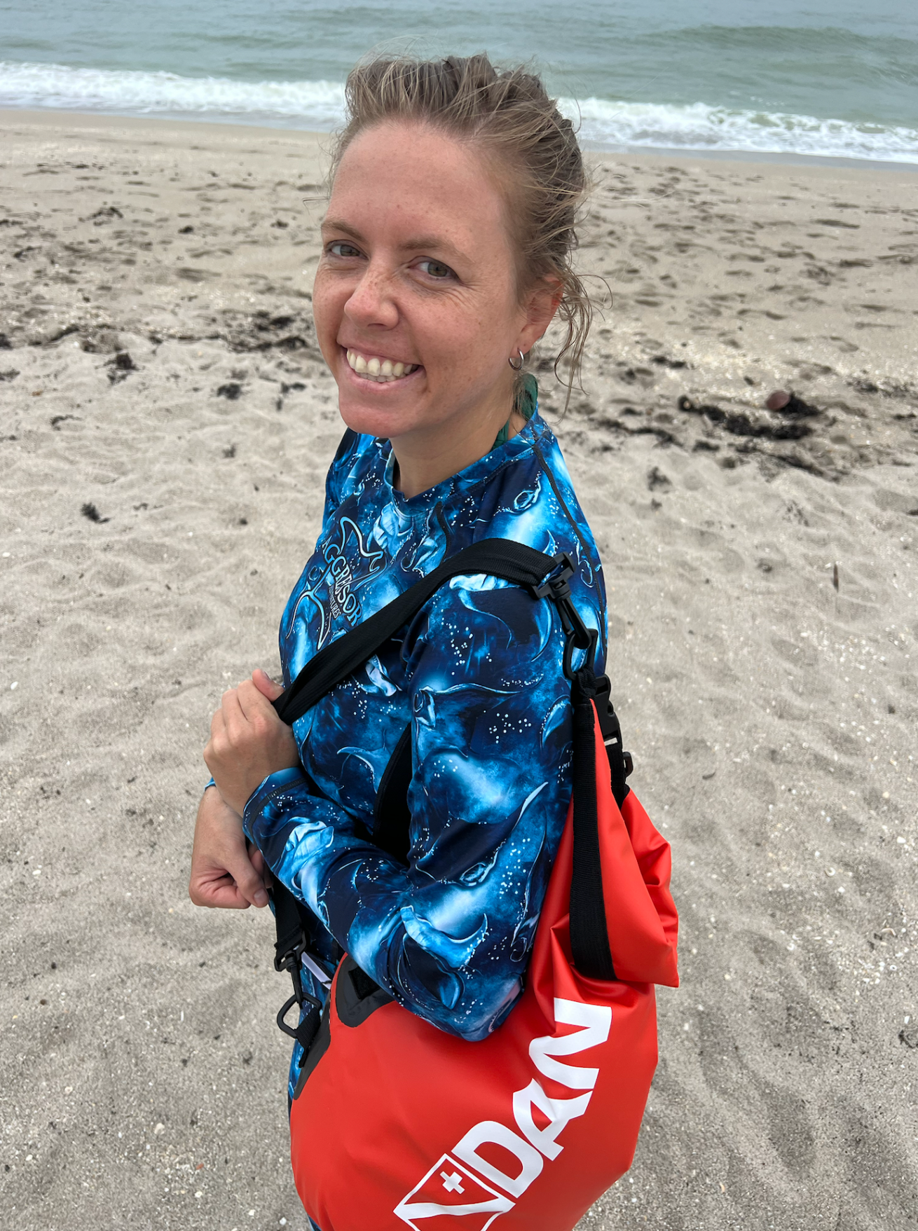 Woman on the beach smiling