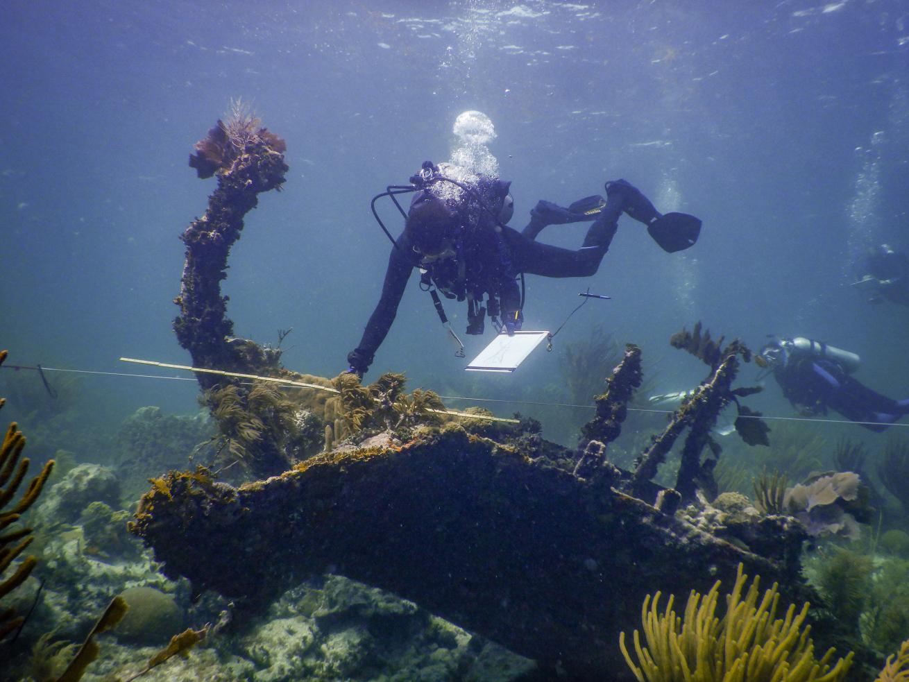 Kamau Sadiki helps document a shipwreck in the Florida Keys unrelated to the slave trade. His drawing will be added to a site map that tells the story of the wreckage. 