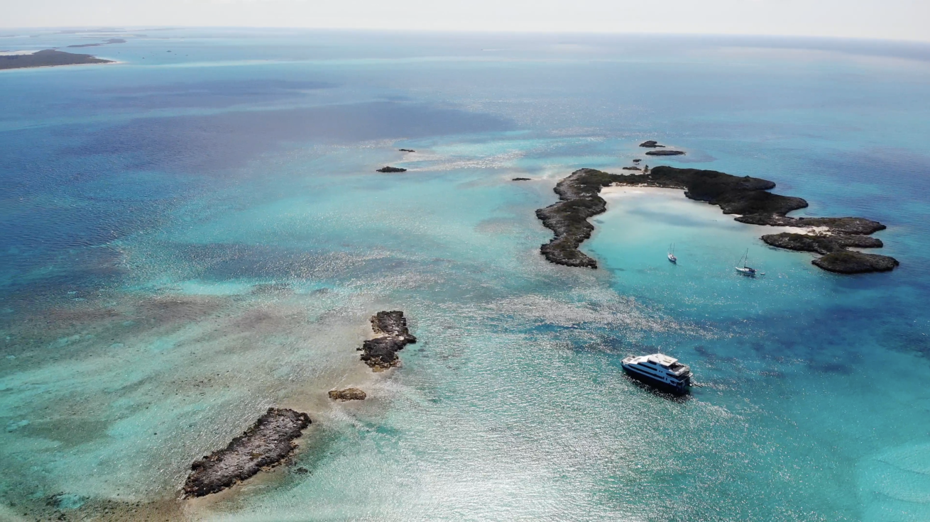 Boat in water with islands around
