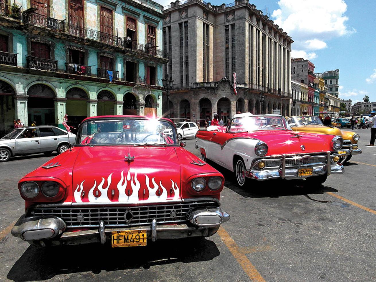 Classic American cars line the streets in Havana
