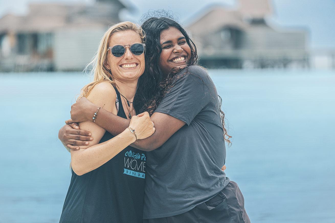 two women divers happy
