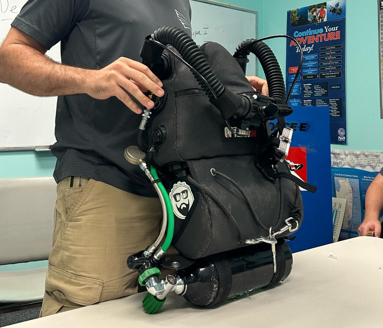 An image of the Dive Rite Chest Mount O2ptima closed circuit rebreather during a classroom training session.