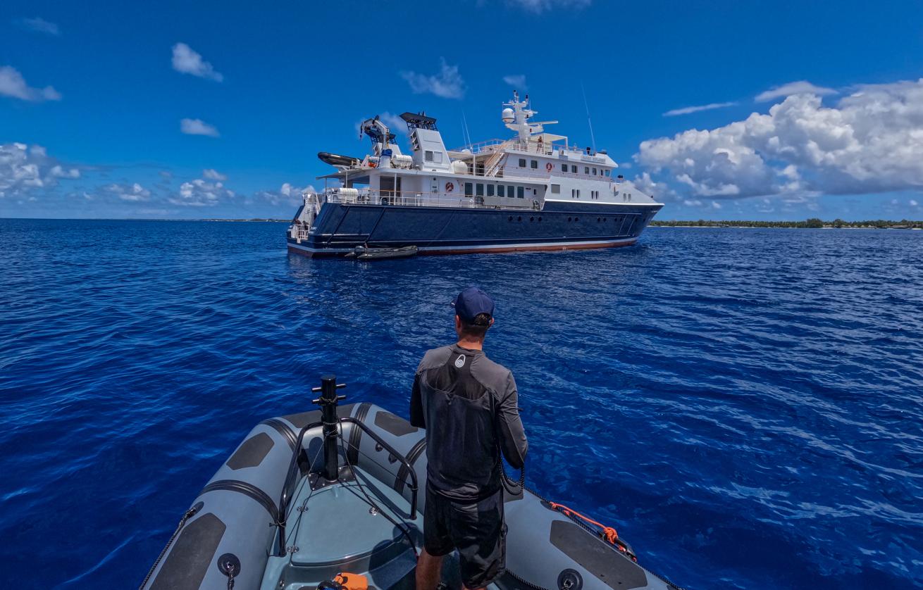 Divers return to the Hanse Explorer, their floating base camp, in between dives.