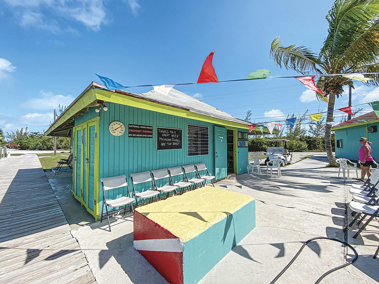 The brightly painted dive shop Guanahani Divers.