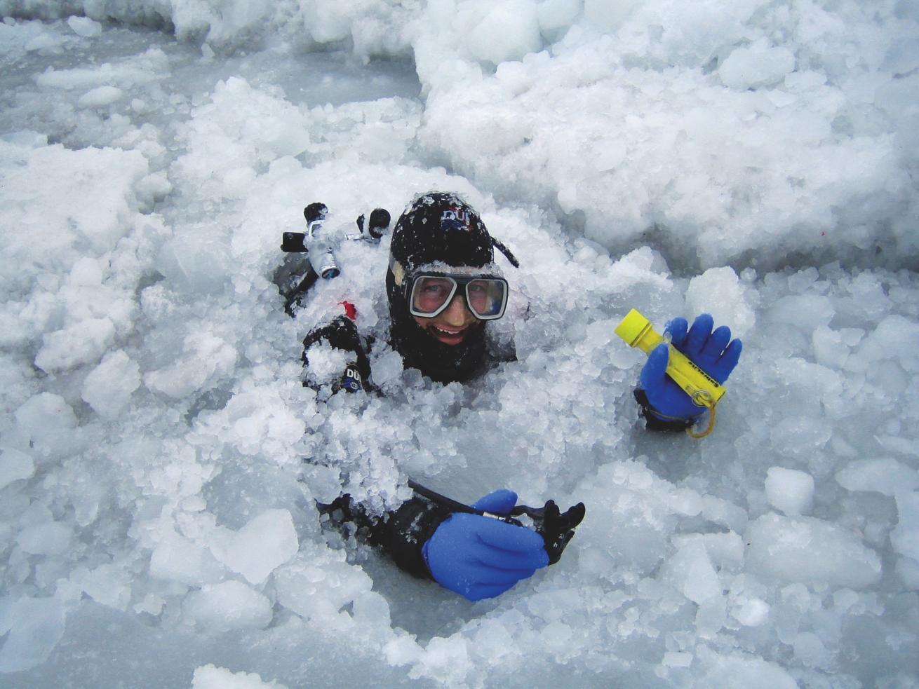 a scuba diver in ice water