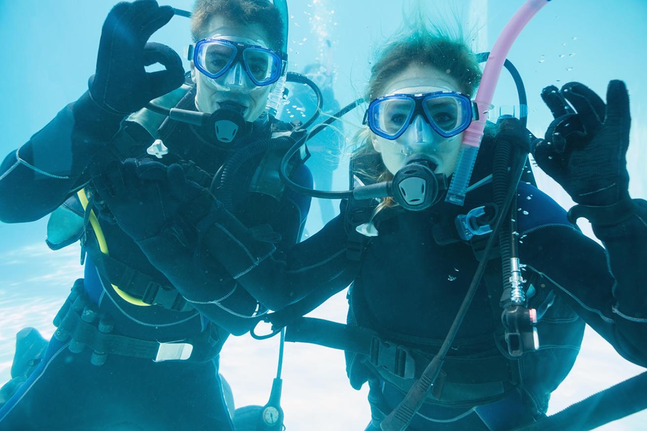 Divers in pool