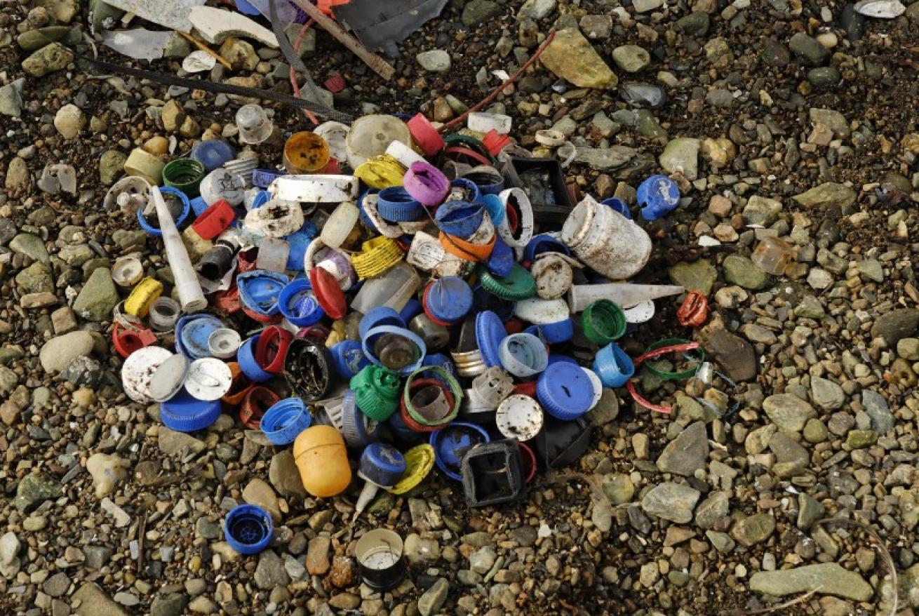 plastic bottle caps on beach