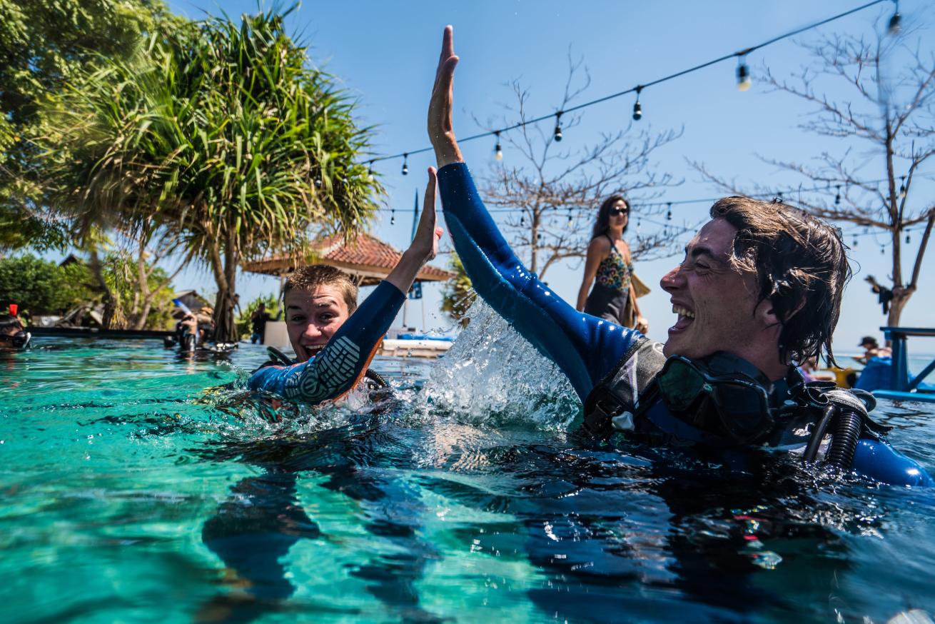 Scuba Divers High Five