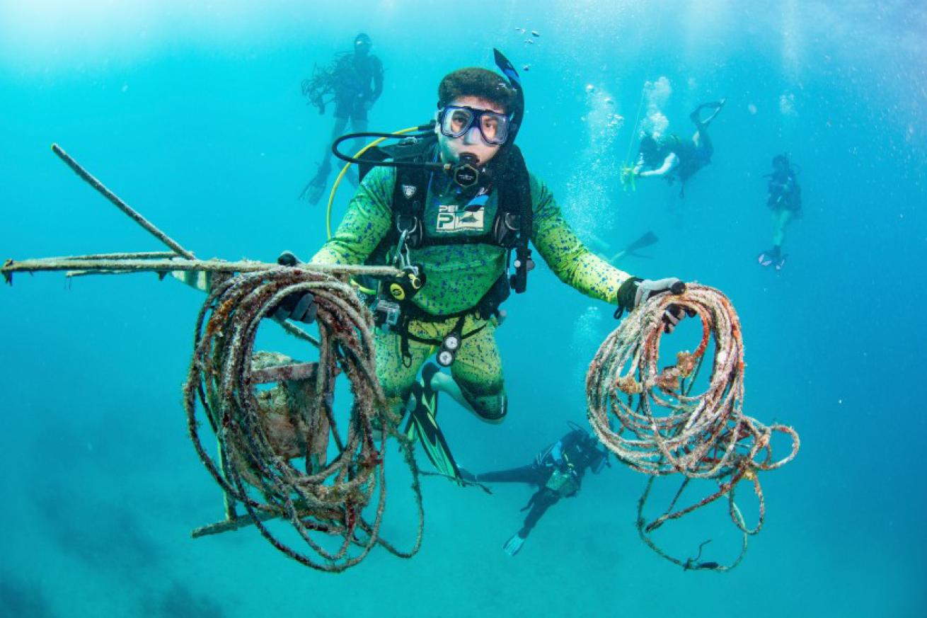 Scuba Divers Remove Trash From Ocean