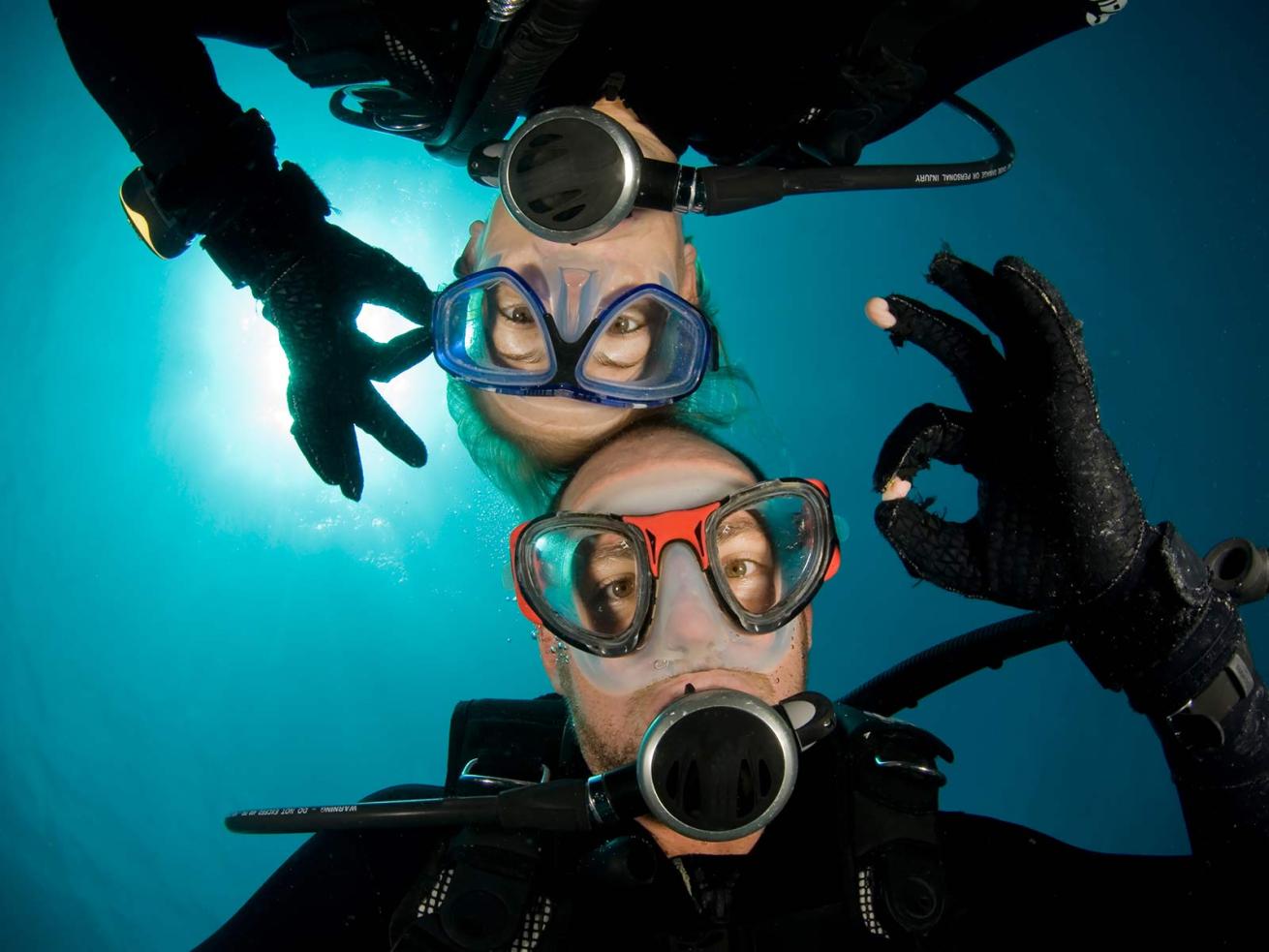 Divers Underwater Giving OK signals