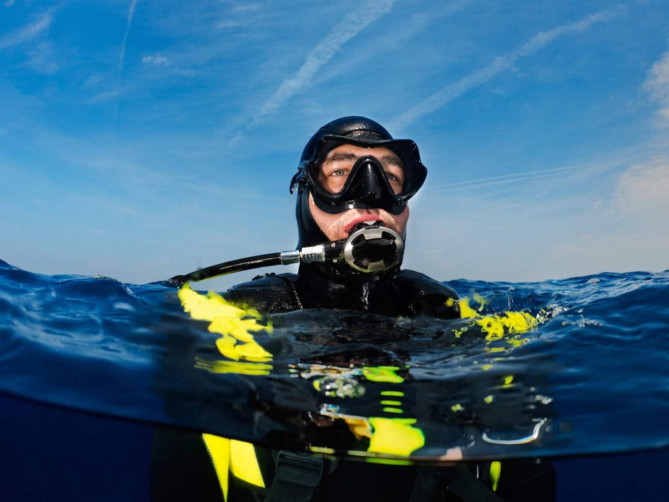 Scuba Diver Alone at Surface Left By Boat