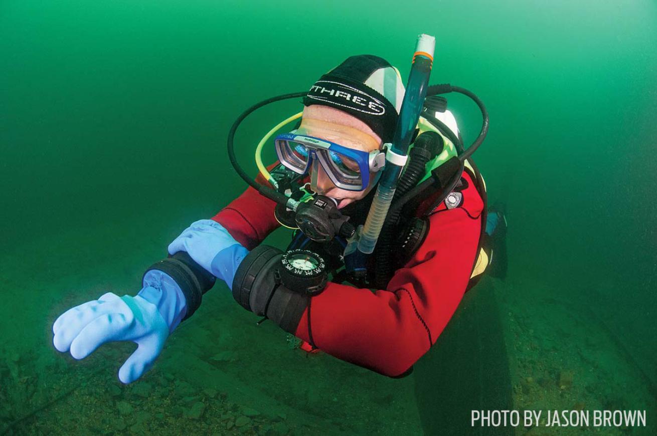 diver navigating with underwater compass