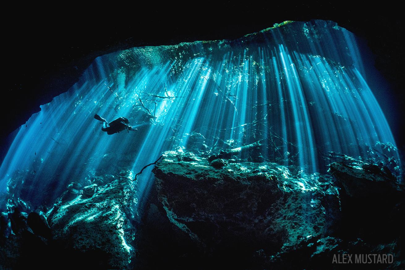 sunbeams in mexican cenote scuba diving