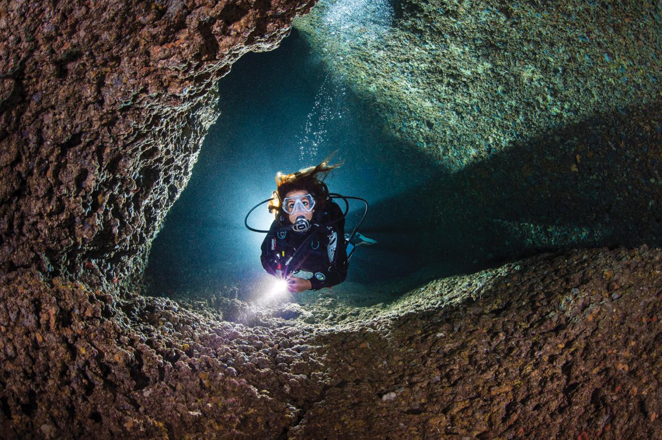 underwater photo of a diver in Italy