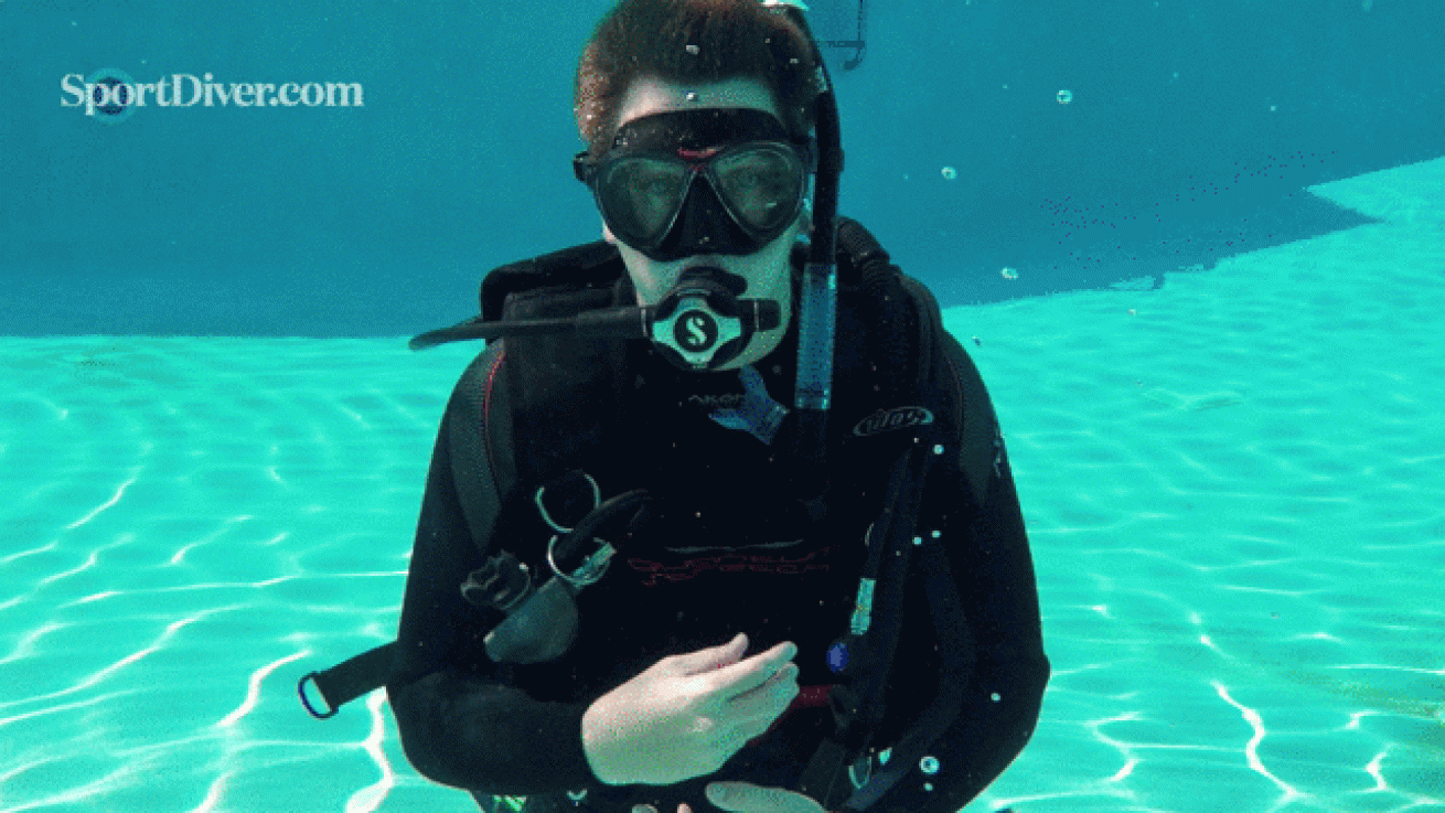 scuba hand signals vomit