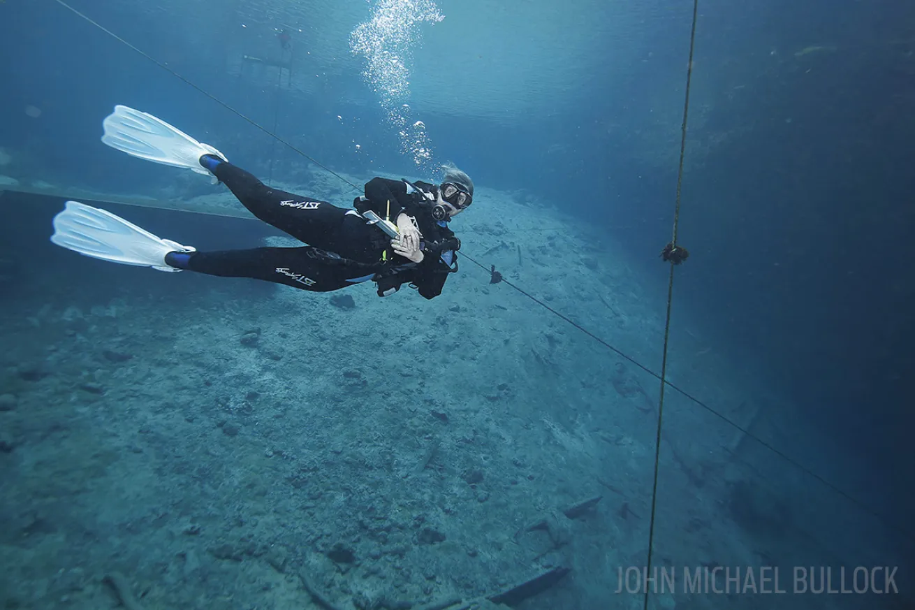 Scuba diver testing gear underwater photo Blue Grotto, Florida