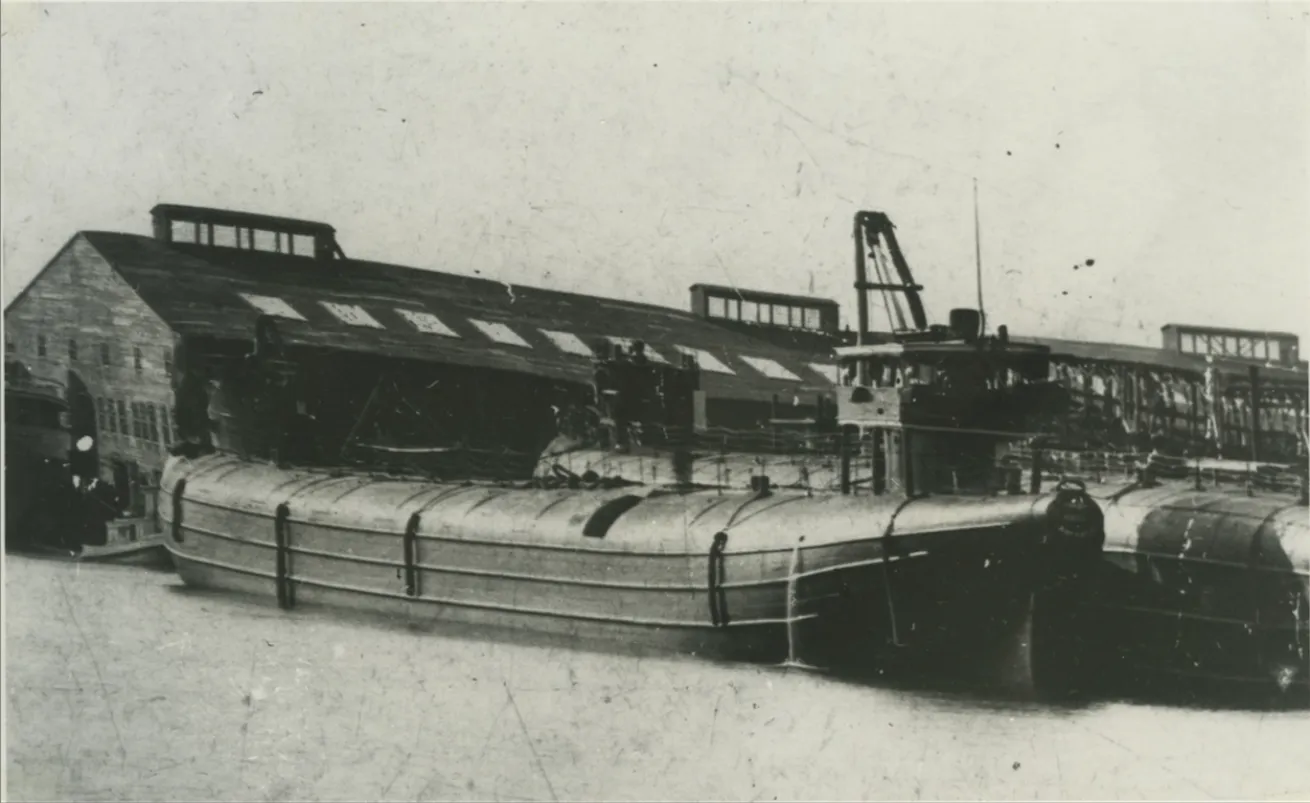 The 300 foot ship Barge 129 at dock.