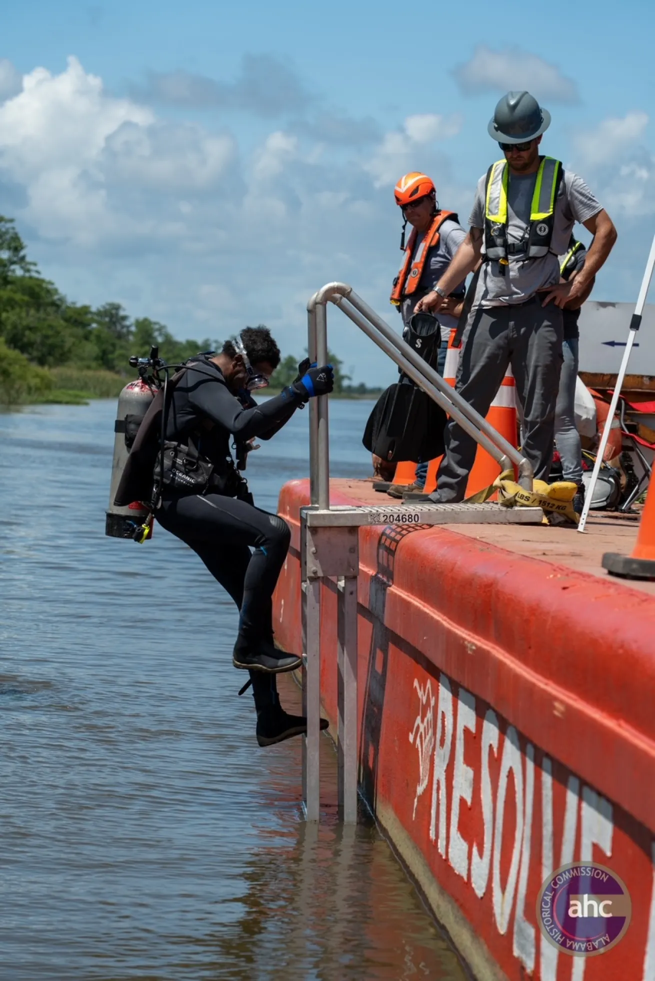 Kamau Sadiki entering the Mobile River to dive the *Clotilda* shipwreck.