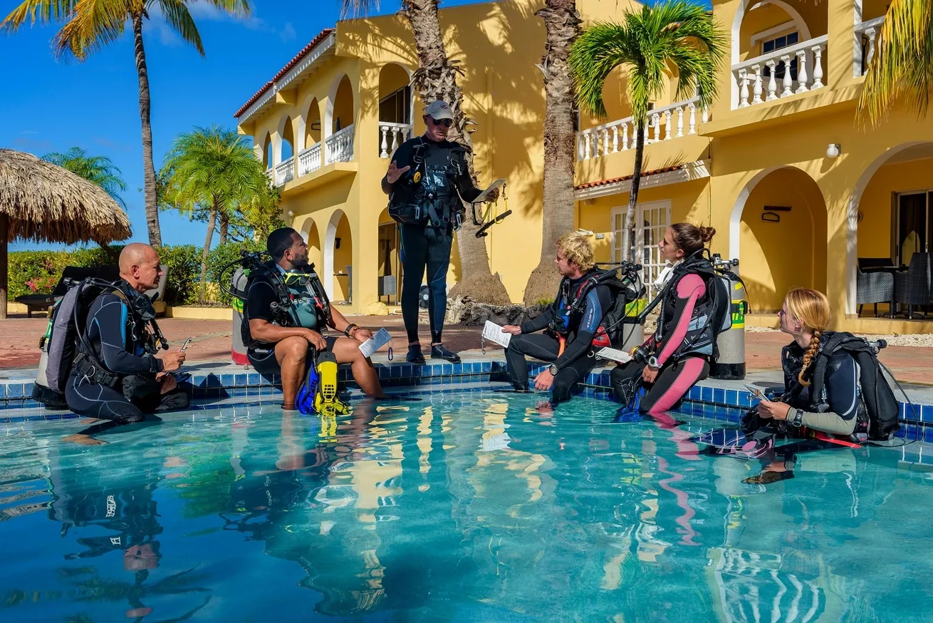 Scuba diving instructor course candiates learning in the pool at Buddy Dive Bonaire.