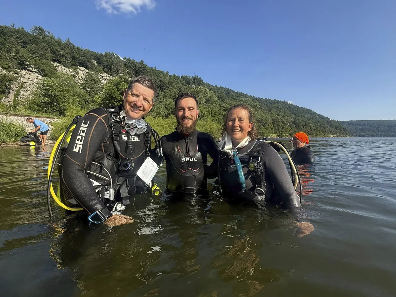 A group is all smiles after a dive.