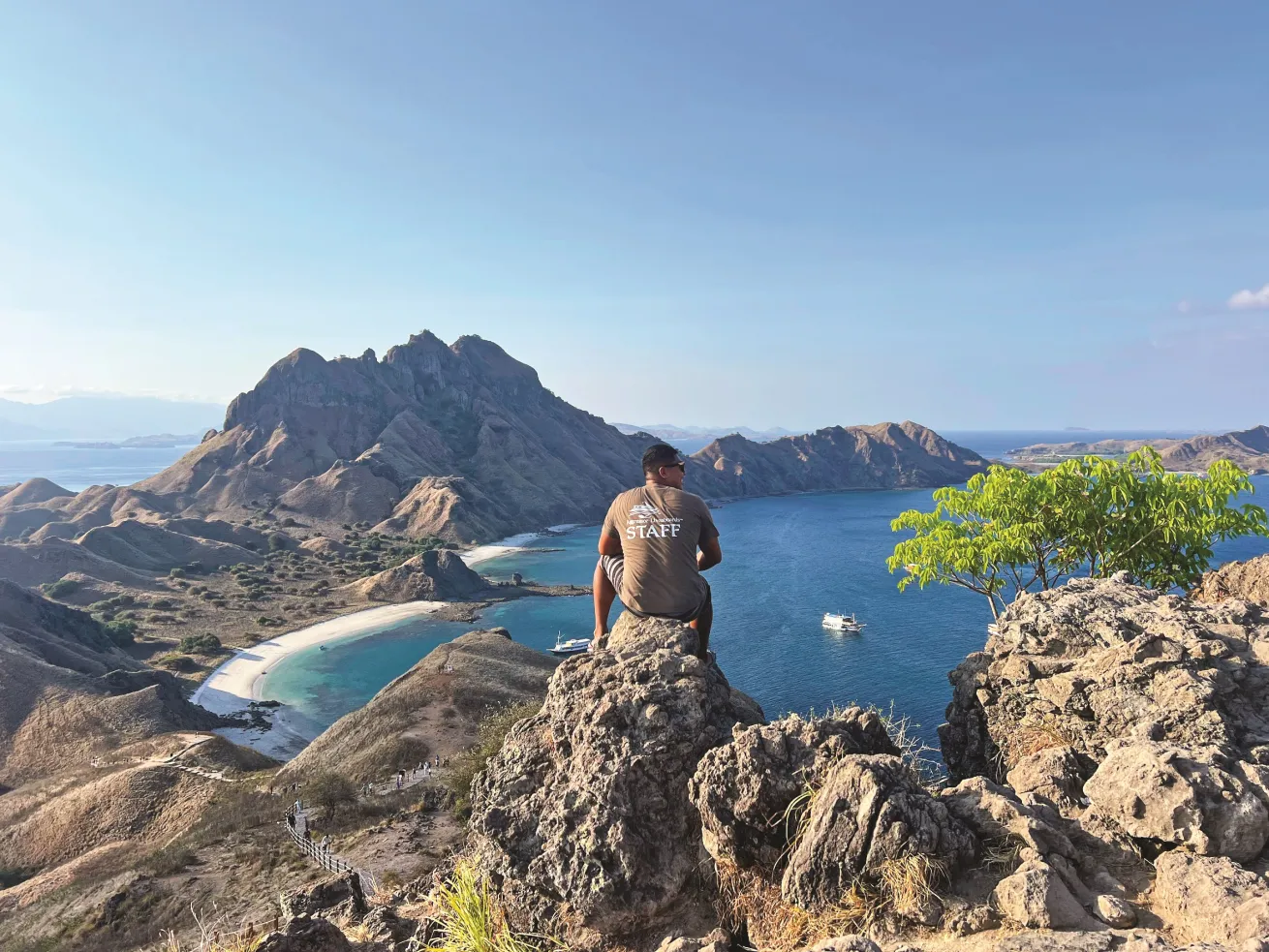 An Aggressor staff member at the top of a popular hike on Padar Island.