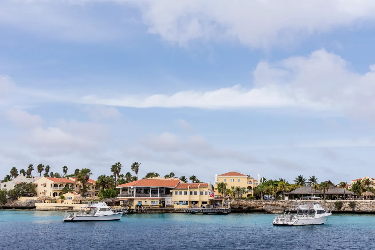 Oceanfront view of Buddy Dive Resort in Bonaire with apartments, dive facilities and waterfront access.