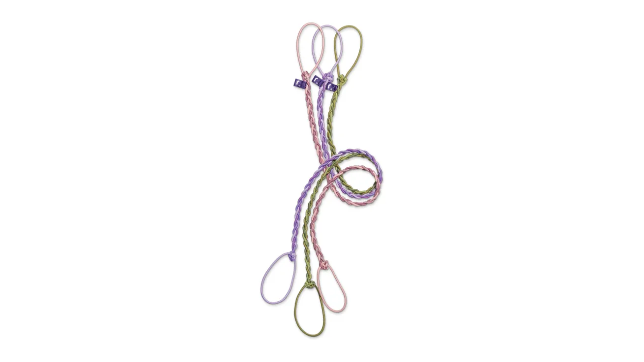 RipTie hair tie in assorted colors and sizes, designed to prevent tangles and hair breakage during diving and high-impact activities.