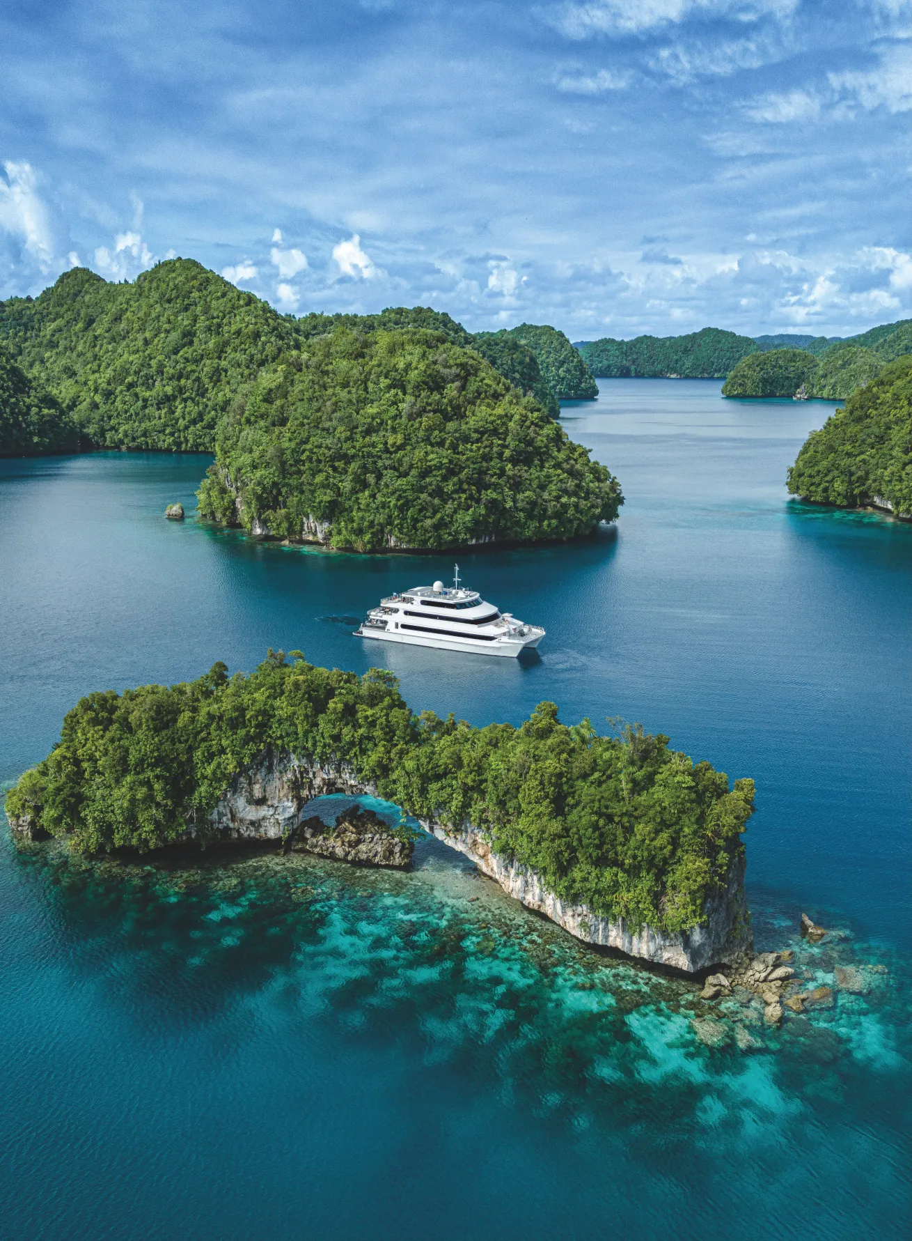 A dive boat turned luxury hotel, *Four Seasons Explorer* whisks divers to Palau’s best sites in style.
