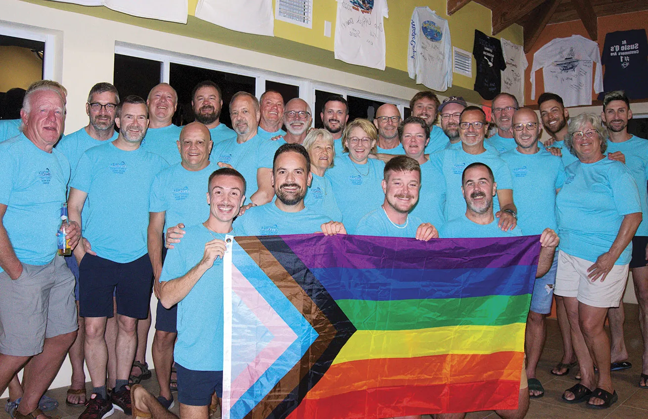 Undersea Expeditions divers gather in the resort’s lounge to celebrate and reminisce after a successful week of shark-spotting.

