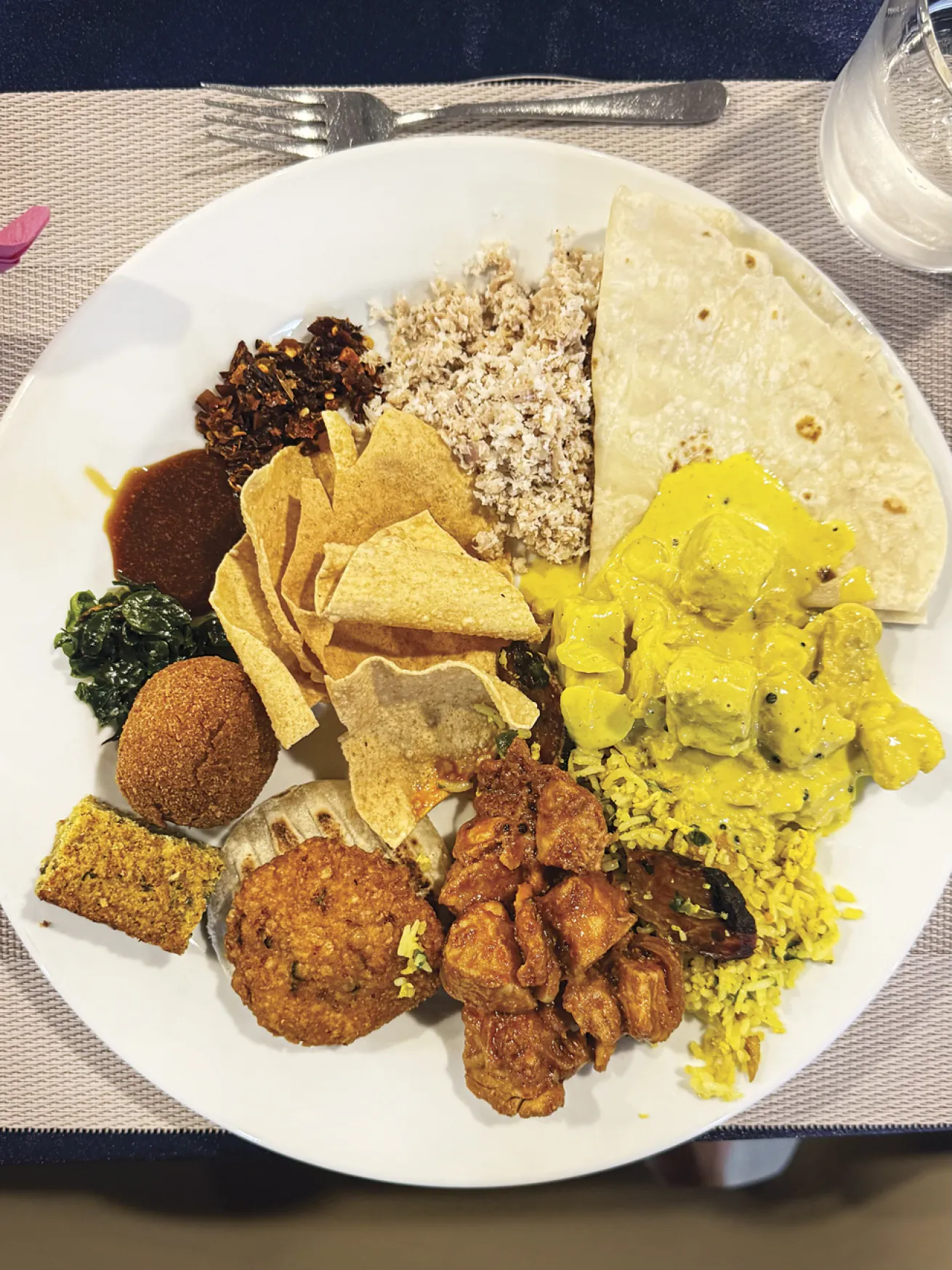 A post-dive plate piled high with a mouthwatering assortment of dishes that heavily feature curries.