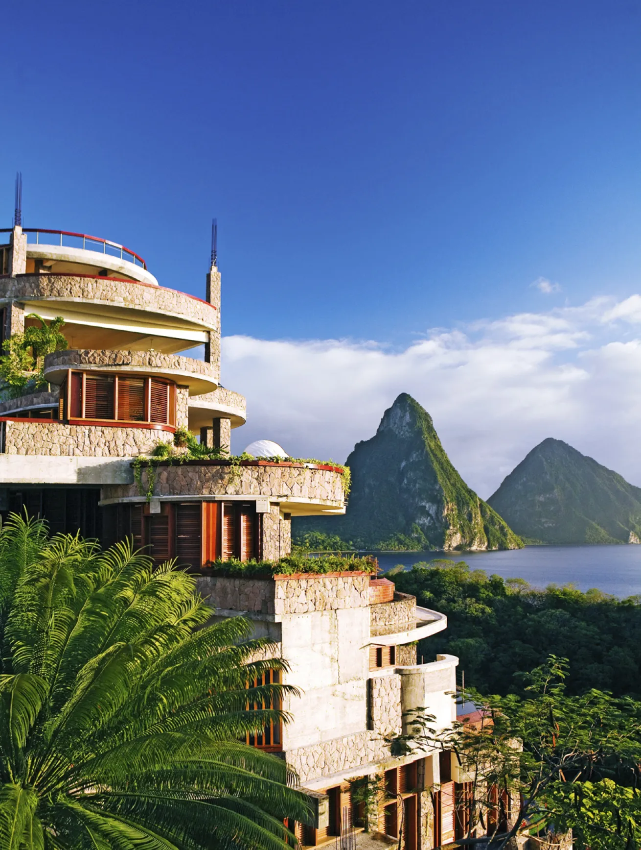 Each suite has a uniquely designed infinity pool with sweeping views of the island’s natural surroundings, including the famed Pitons.