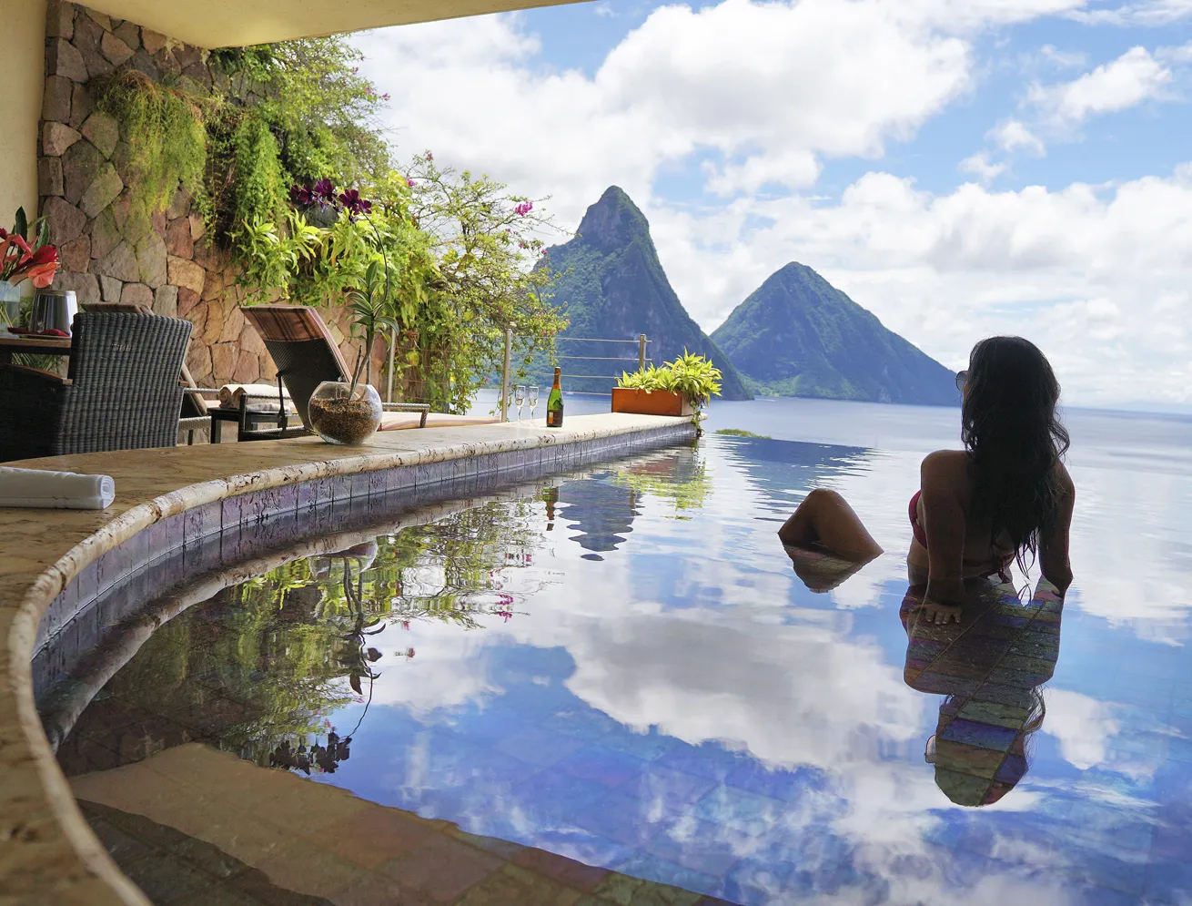 A guest snorkels in the crystal-clear water.