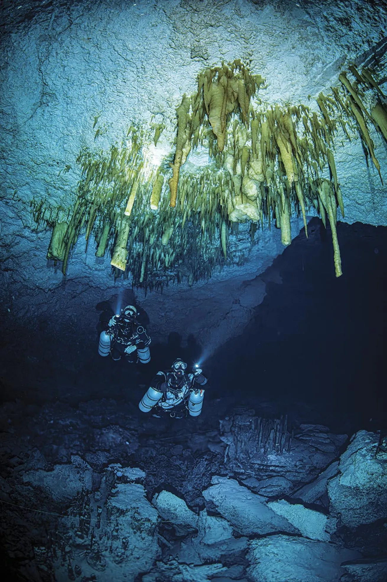 The author (right) and Zenato admire beautiful and delicate cave decorations that have accumulated over hundreds of years.