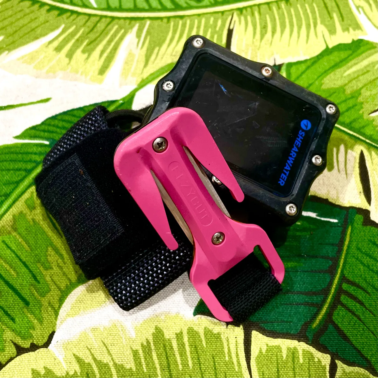 The author's personal line cutter stowed on her wrist computer.