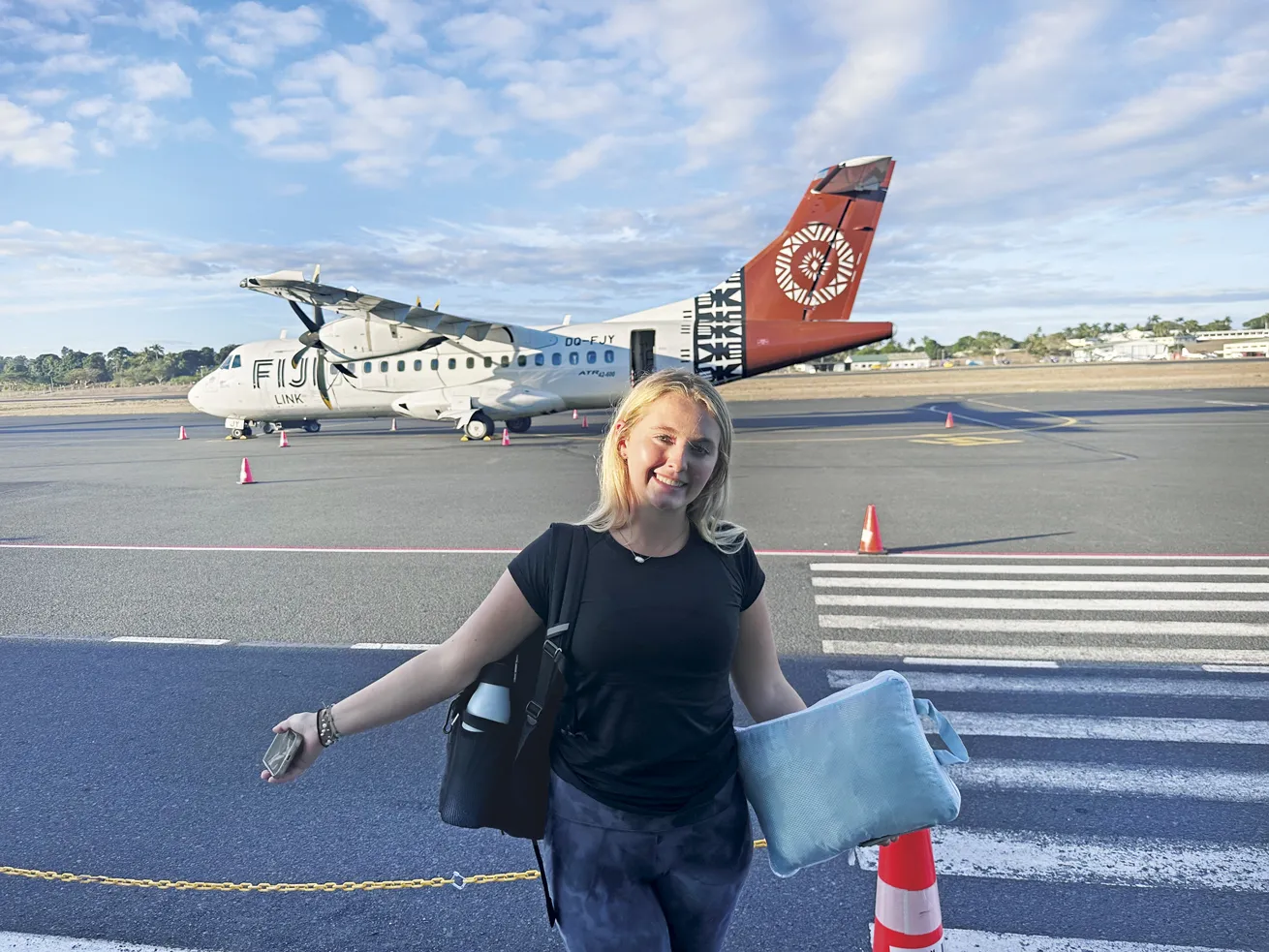 18-year-old Maddy is all smiles before boarding a 12-seat Fiji Link plane to Taveuni.