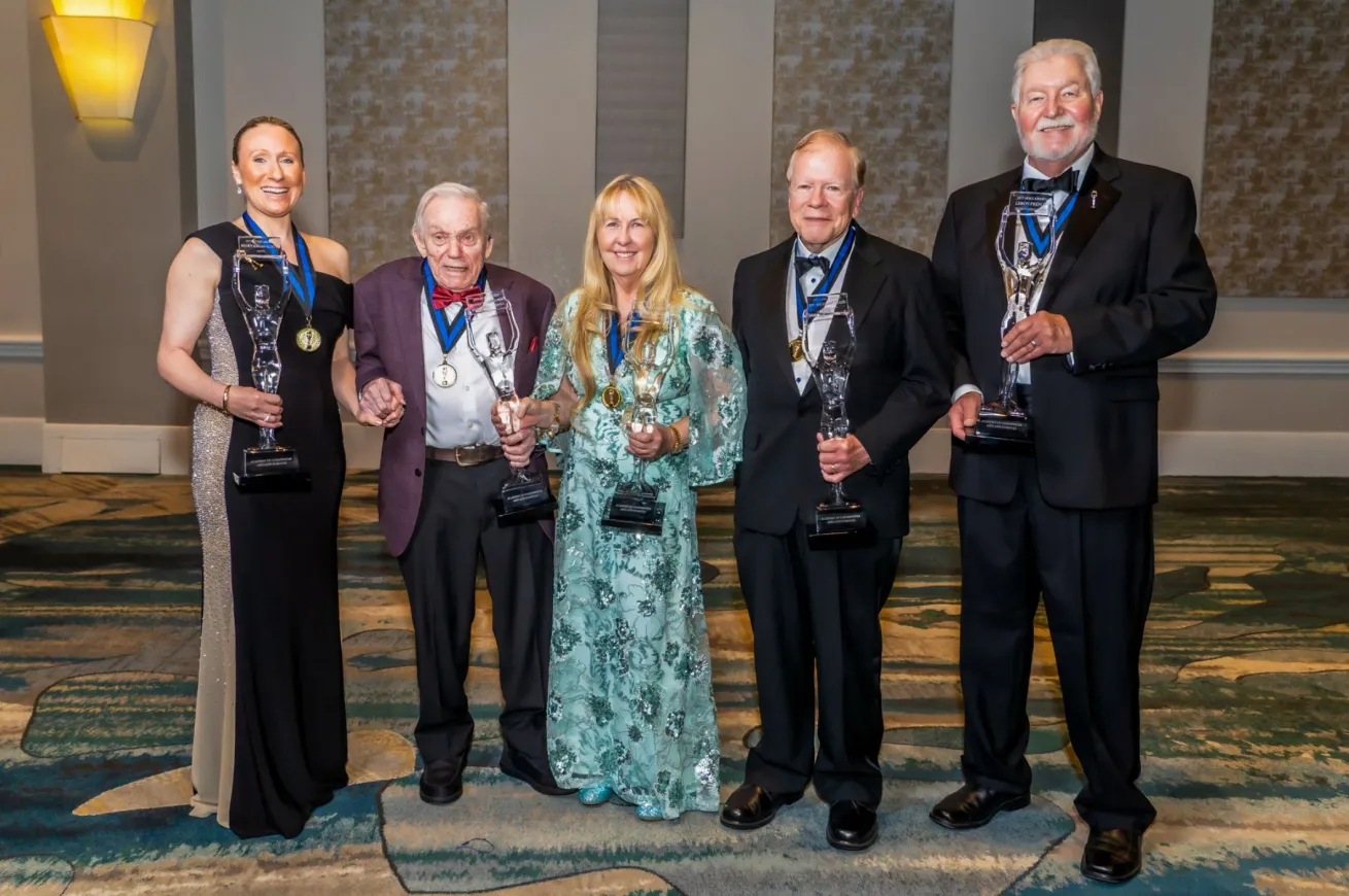 Group photo of 2025 NOGI Awards Class. L-R: Becky Kagan Schott (Arts), Dick Rutkowski (Distinguished Service), Georgienne Bradley (Environment), Dr. Richard Moon (Science), LeRoy French (Sports/Education, accepted by Dan Orr).
