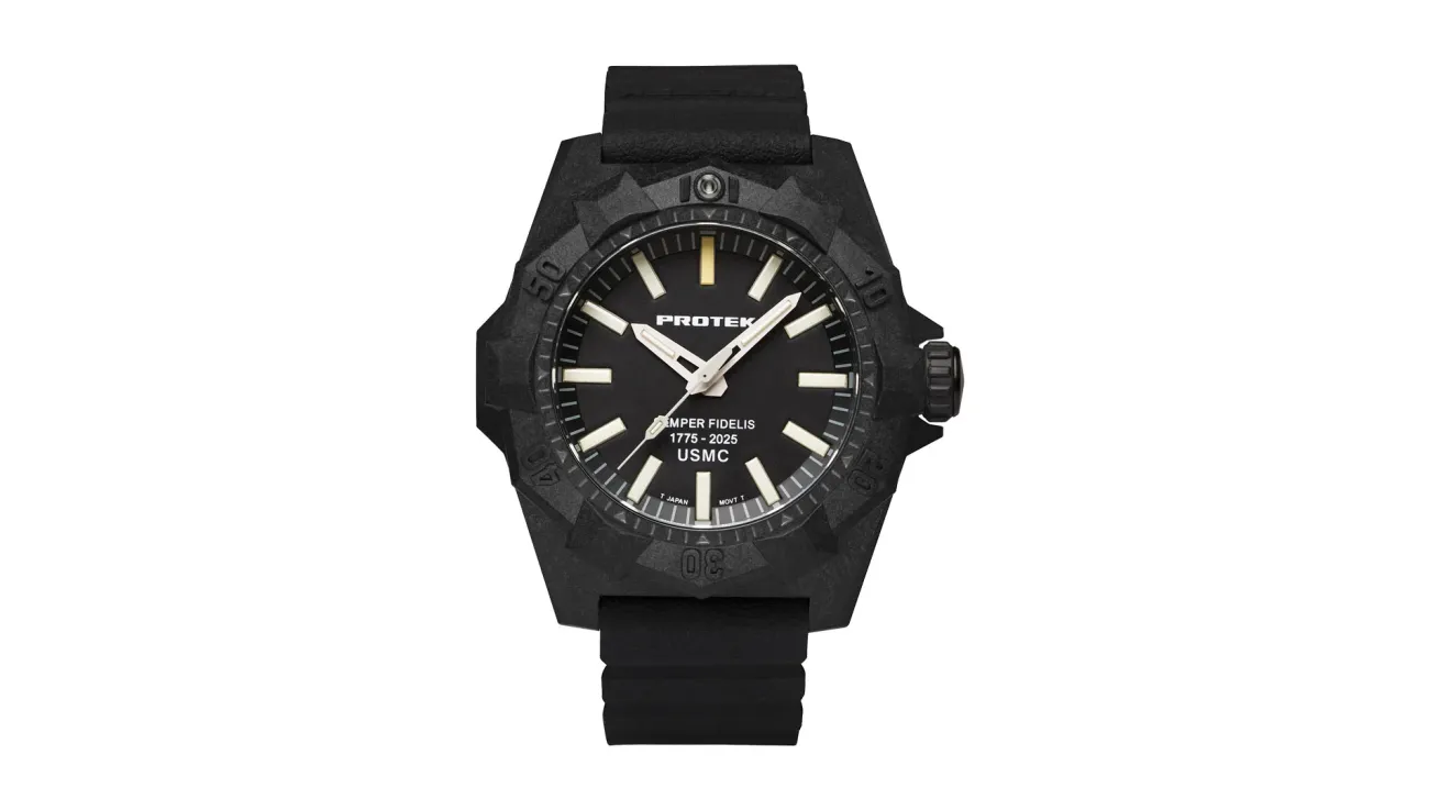 Black dive watch with a carbon-composite case, bold luminous markers, and a rubber strap, designed for underwater use.