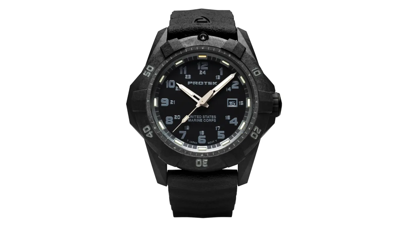 Black dive watch with a carbon-composite case, dual 12/24-hour dial, luminous markers, and a rubber strap for underwater use.