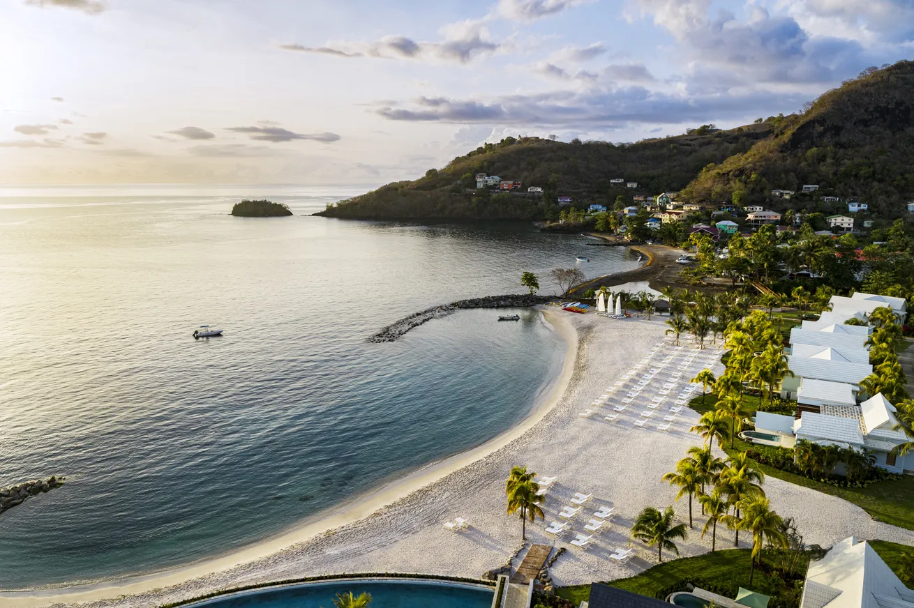 The setting sun blankets Saint Vincent’s coast in soft, warm light.