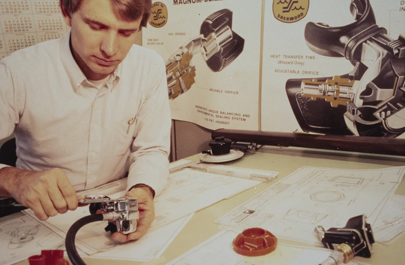 A Sherwood engineer reviews a design in the late 1970s.