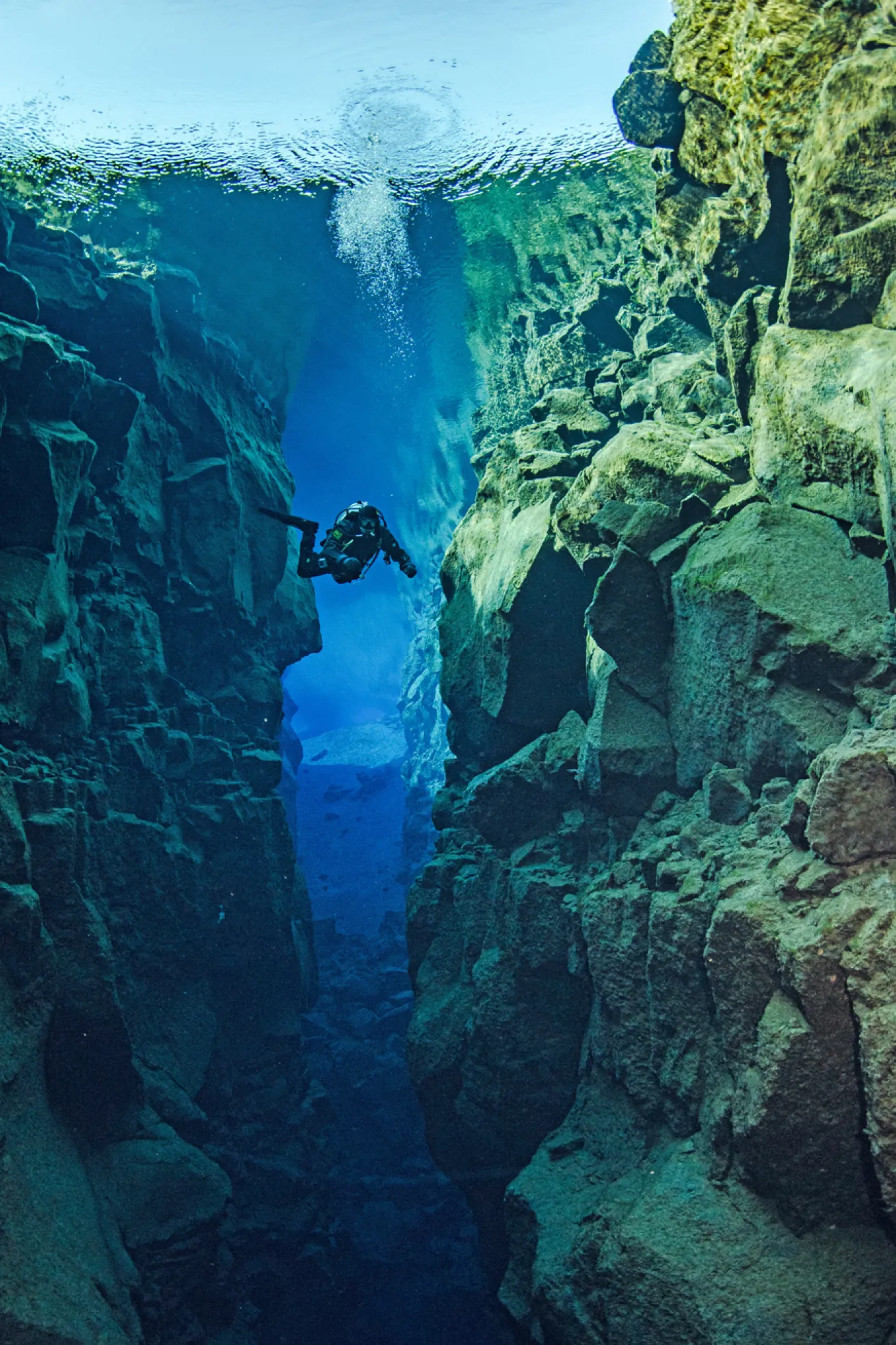 diver in iceland between tectonic plates