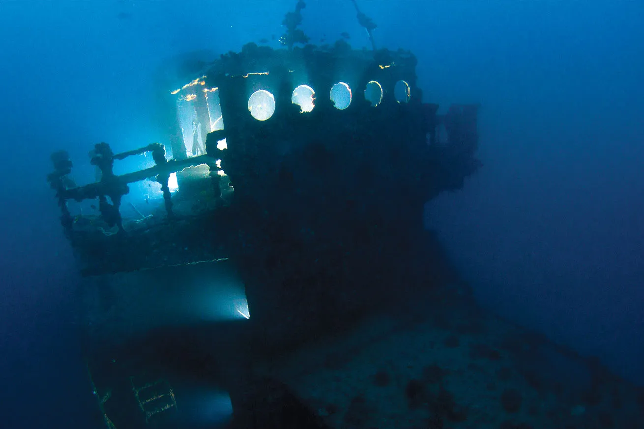A dive light illuminates the bridge of the *YO-257*.