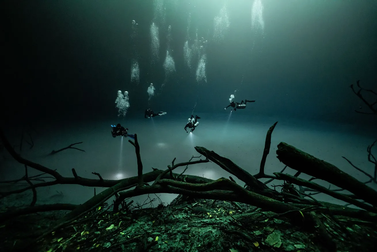 divers in cenote angelita 