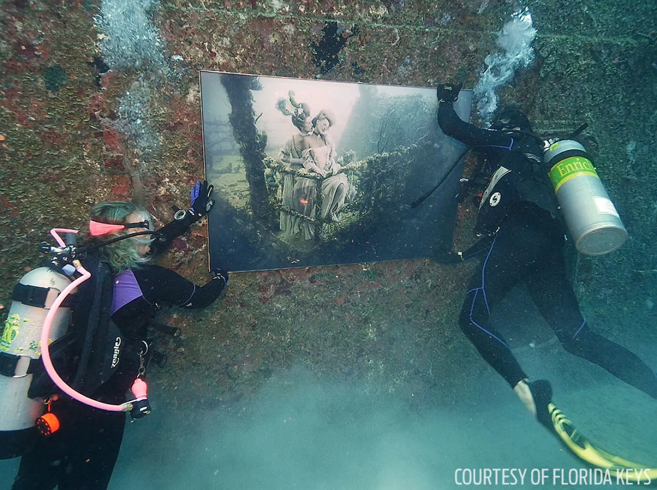Scuba divers install art on the Vandenberg Key West
