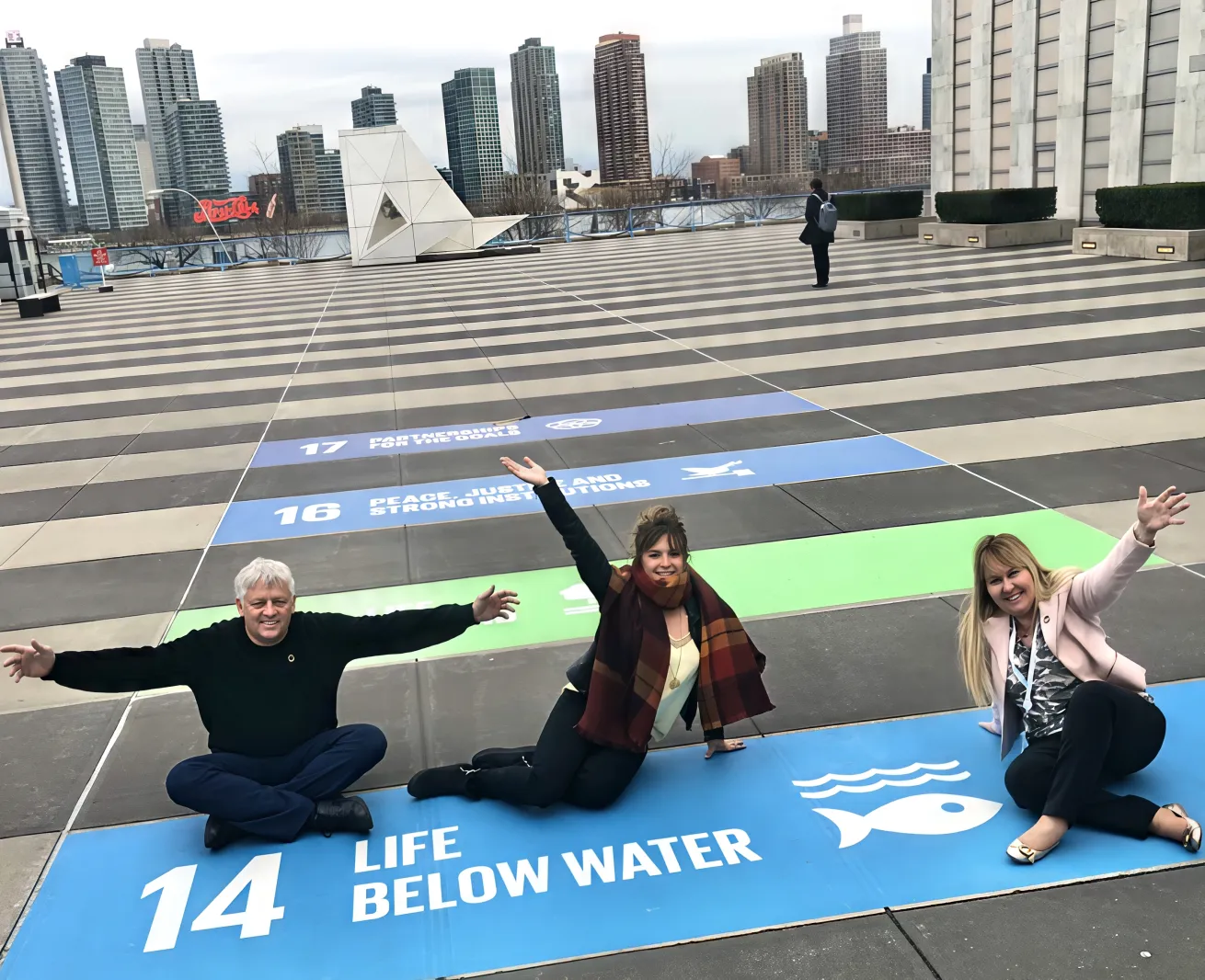 Bradley (right) with colleagues Jay Ireland and Melissa Martinez outside the United Nations, representing Sustainable Development Goal 14, Life Below Water