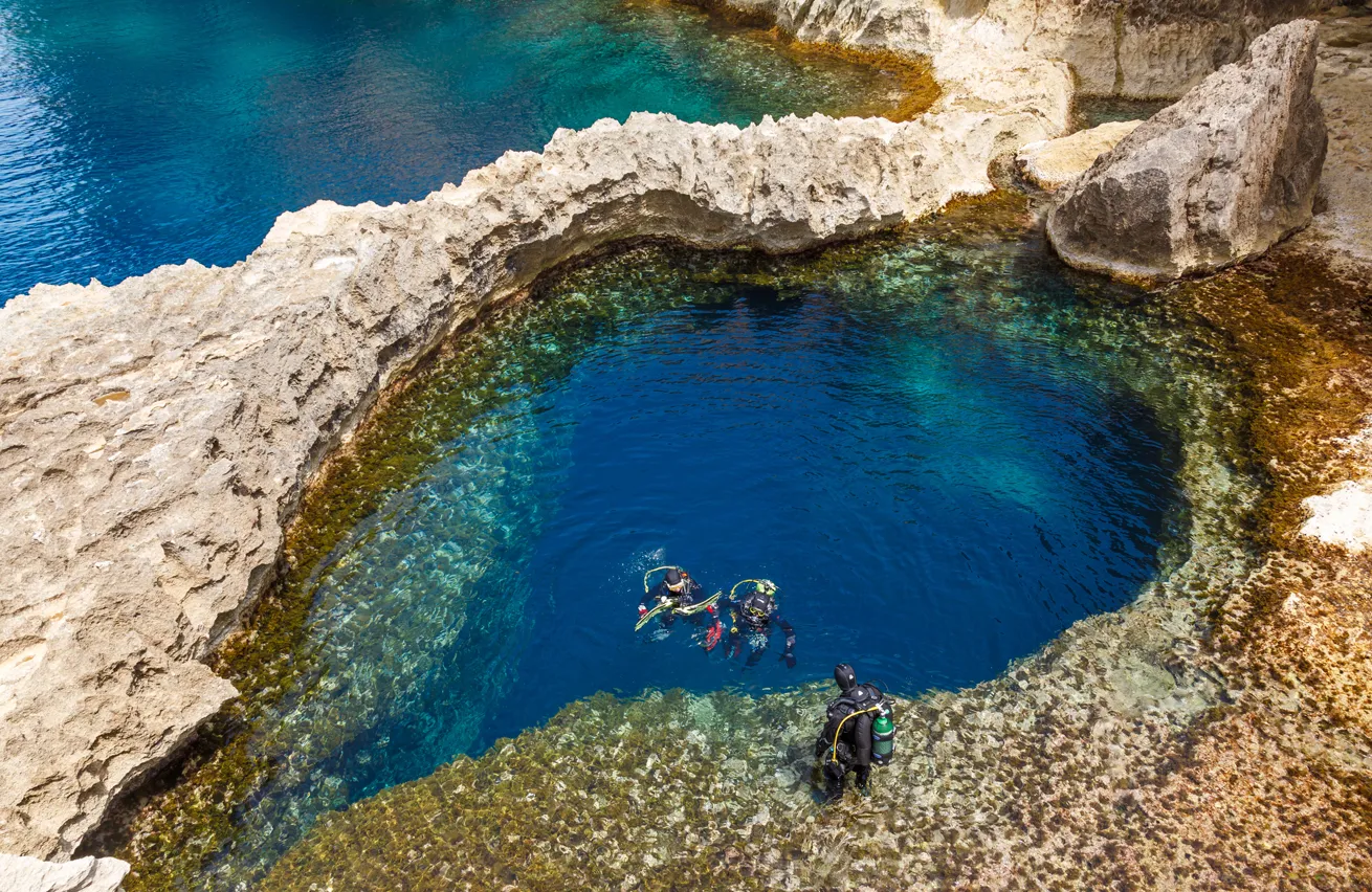 A lovely heart-shaped opening marks the entrance of an underwater cave near Azure Window in Gozo, Malta.