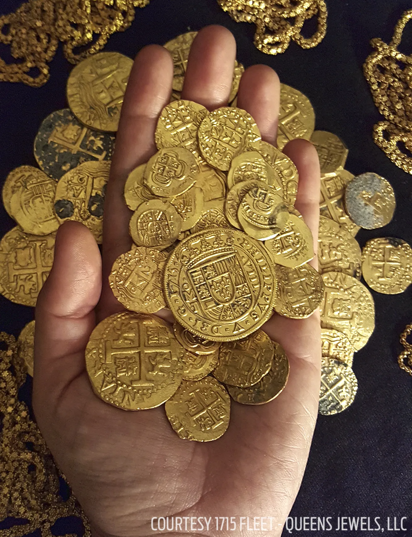 Piles of recovered gold coins salvaged from shipwrecks