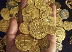 Piles of recovered gold coins salvaged from shipwrecks