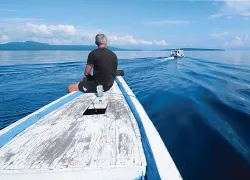 A solo diver overlooking the waters of Bali 